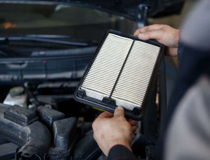 Technician Holding Dirty Filter