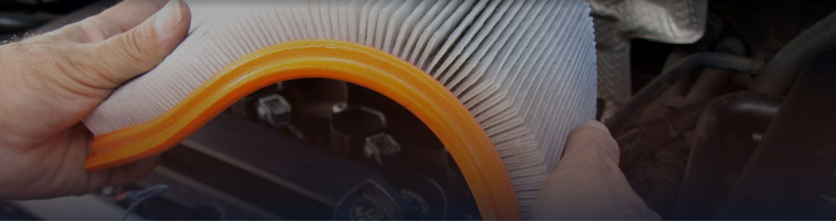 Technician Flexing Orange Air Filter